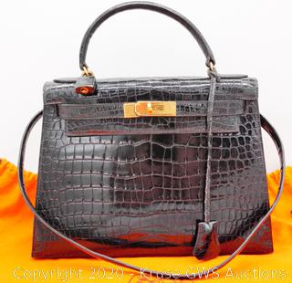 Sold at Auction: An Hermès black crocodile Kelly bag, 1950s, crocodylus  porosus, the gilt ha