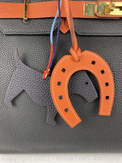 A SPECIAL ORDER HORSESHOE ORANGE H, GOLD & CHOCOLATE TOGO LEATHER